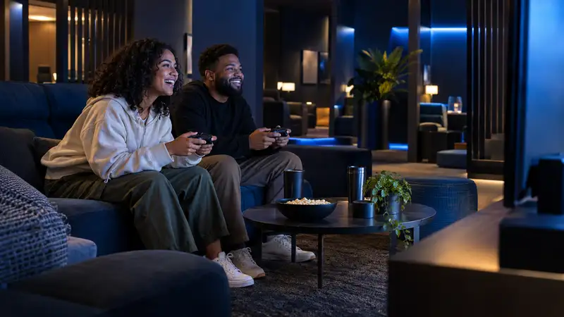 Friends enjoying a console session in a gaming lounge