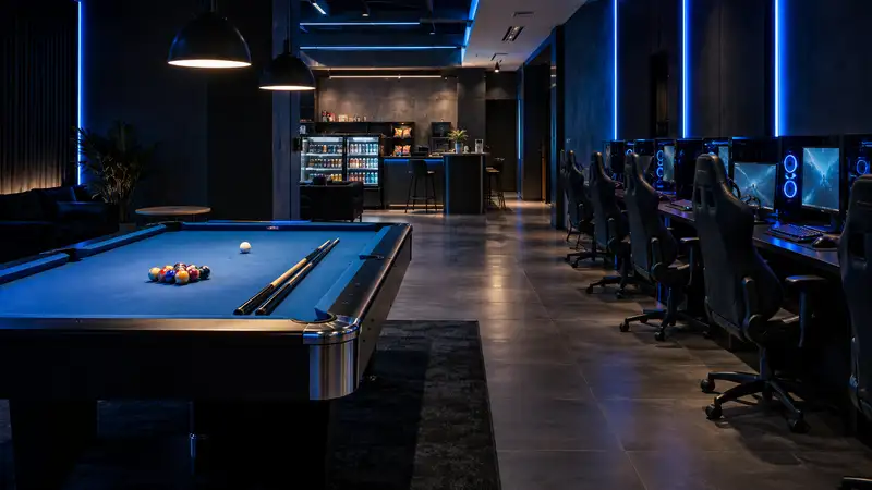 A blue-felt pool table with balls and cues in a contemporary gaming venue
